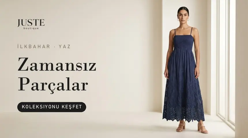 'Zamansız Parçalar' başlığı, 'Koleksiyonu keşfet' düğmesi ve lacivert elbiseli manken; site vitrin bannerı, panel üretimi